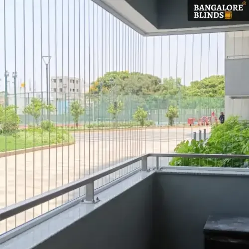 Invisible vertical safety grill on a balcony